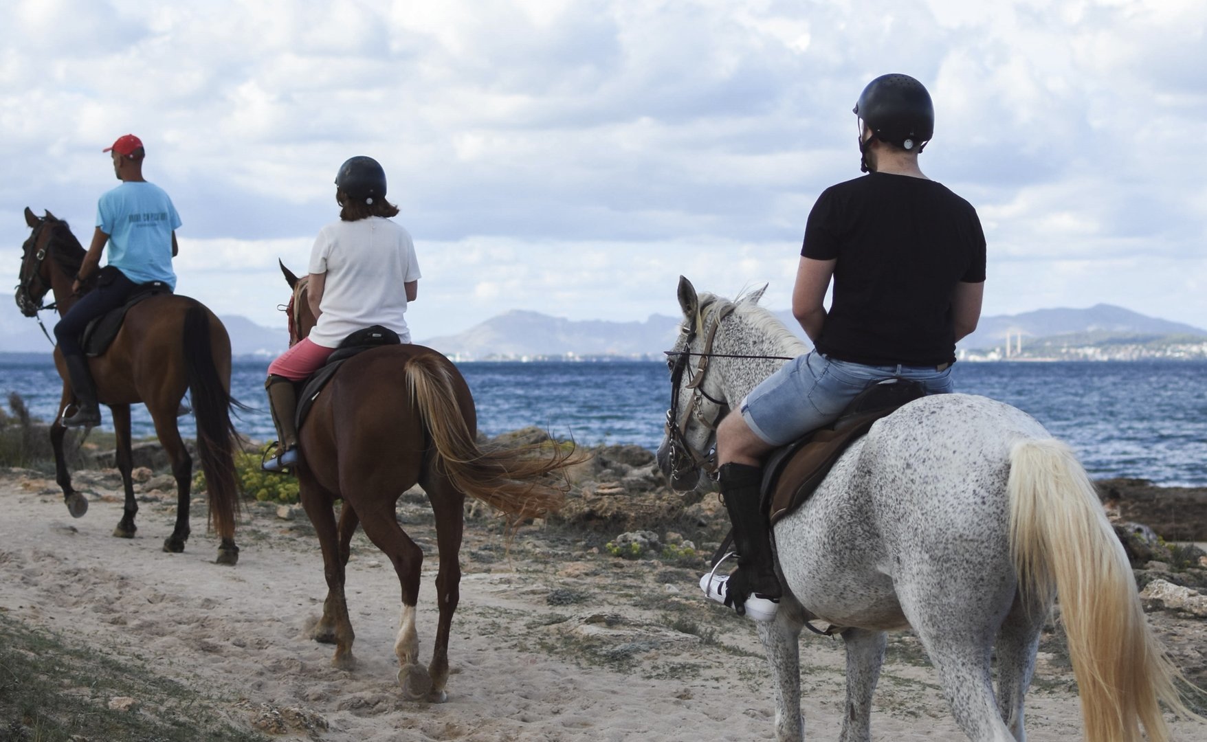 horse riding along the beach